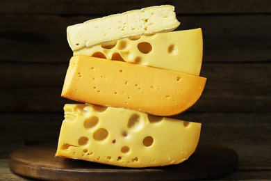 Photo of Different types of cheese on table, closeup