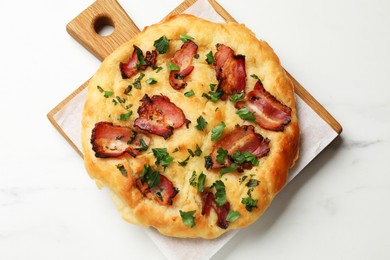 Photo of Delicious focaccia bread with bacon and parsley on white table, top view