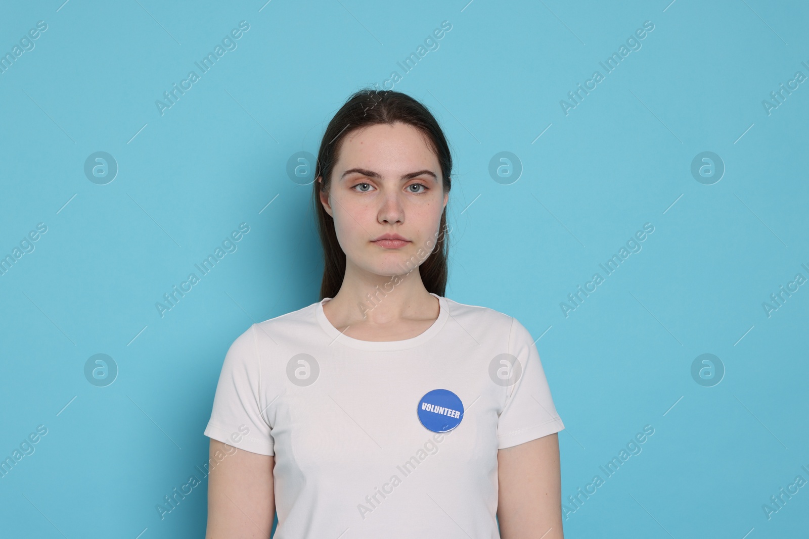 Photo of Portrait of volunteer on light blue background