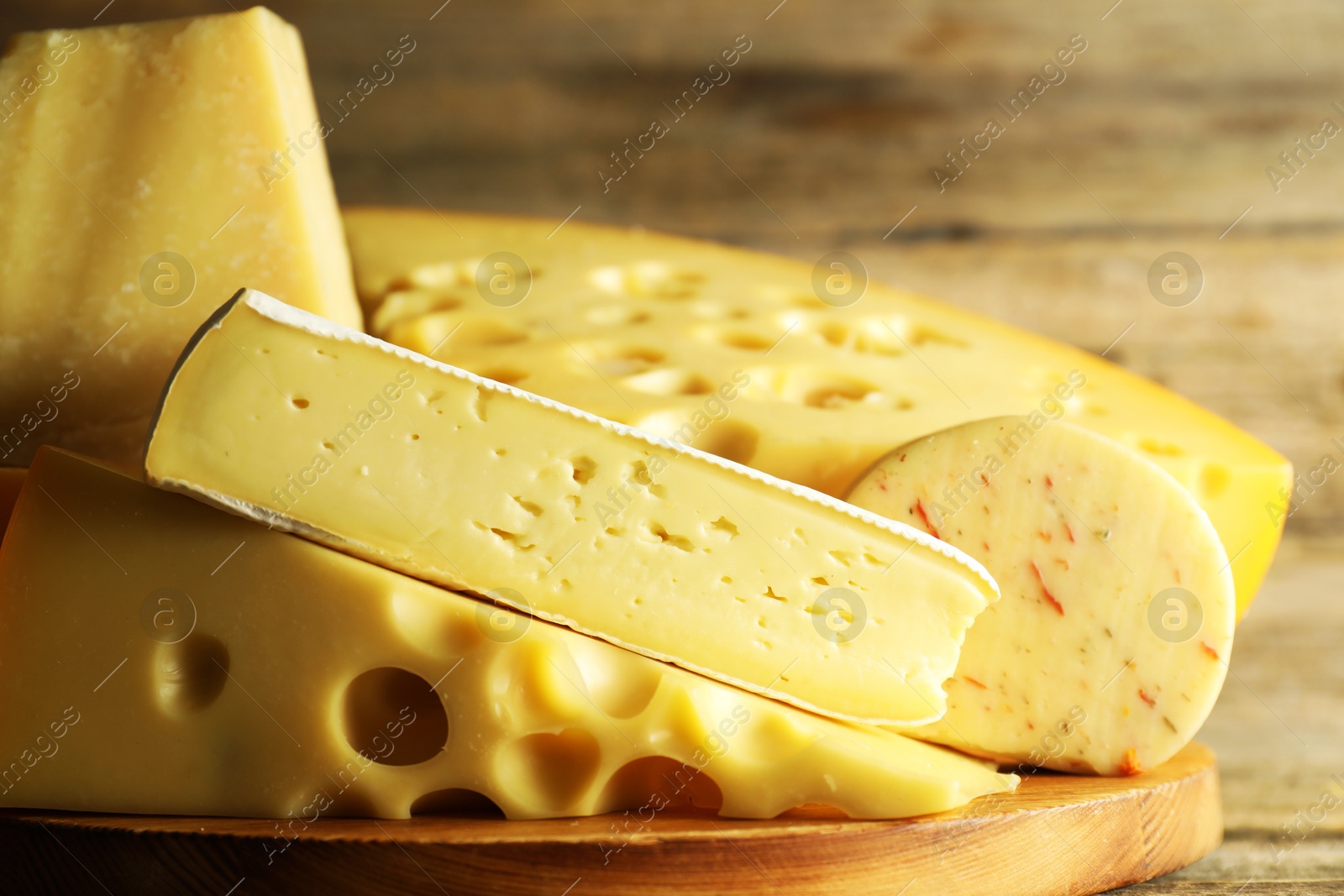 Photo of Different types of cheese on table, closeup