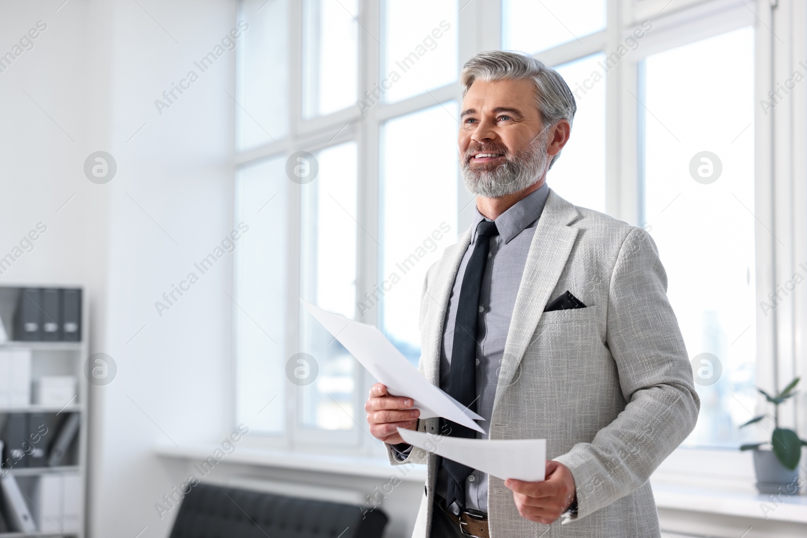 Photo of Banker with documents in office, space for text