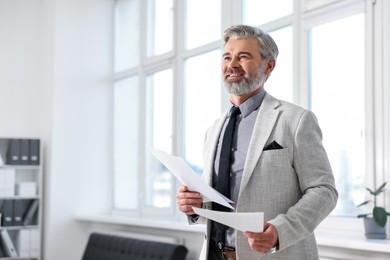 Photo of Banker with documents in office, space for text