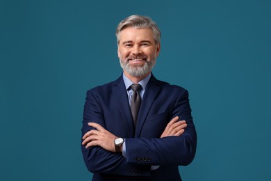 Photo of Banker with crossed arms on blue background