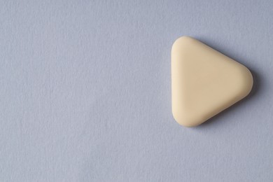 Photo of One eraser on grey background, top view. Space for text