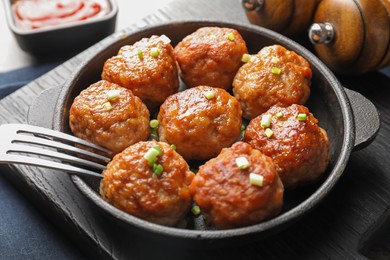 Photo of Tasty meatballs served on grey table, closeup