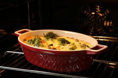 Photo of Delicious baked vegetable casserole in oven, closeup