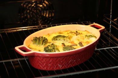 Photo of Delicious baked vegetable casserole in oven, closeup