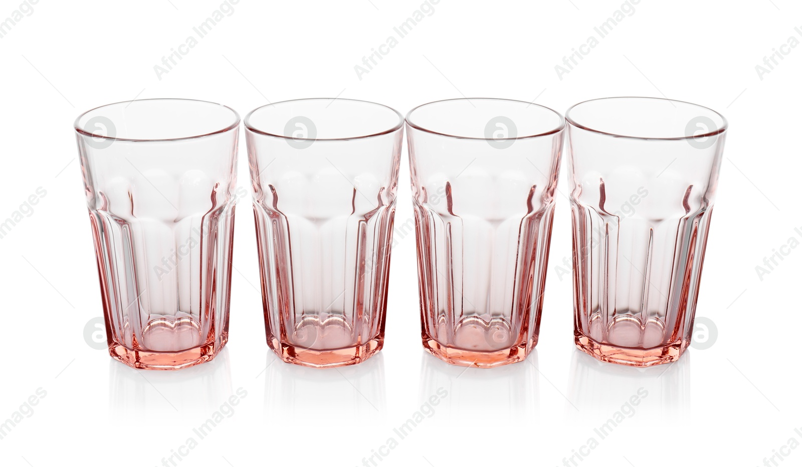 Photo of Many empty clean glasses isolated on white