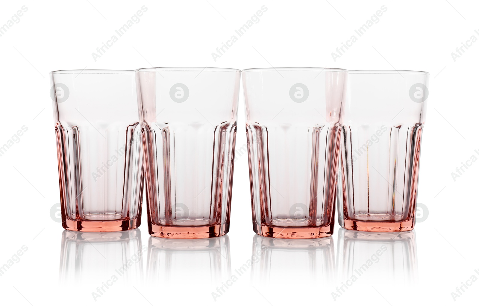 Photo of Many empty clean glasses isolated on white