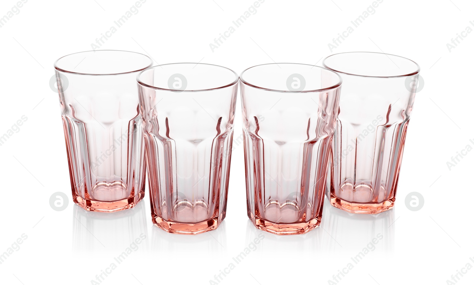 Photo of Many empty clean glasses isolated on white