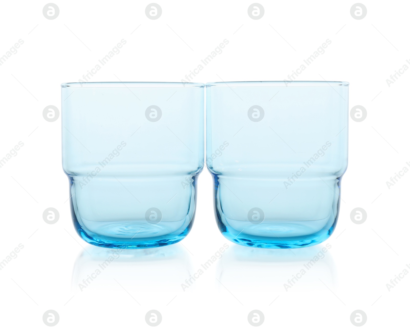 Photo of Two empty clean glasses isolated on white