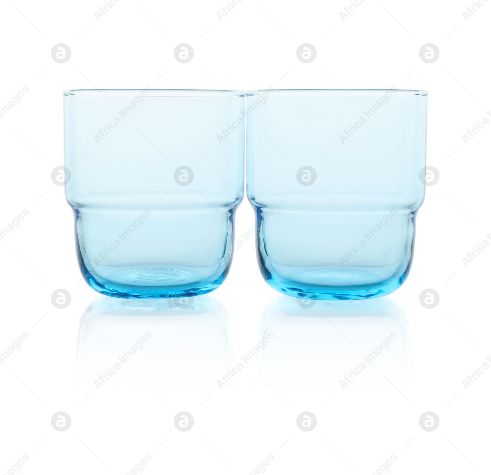 Photo of Two empty clean glasses isolated on white