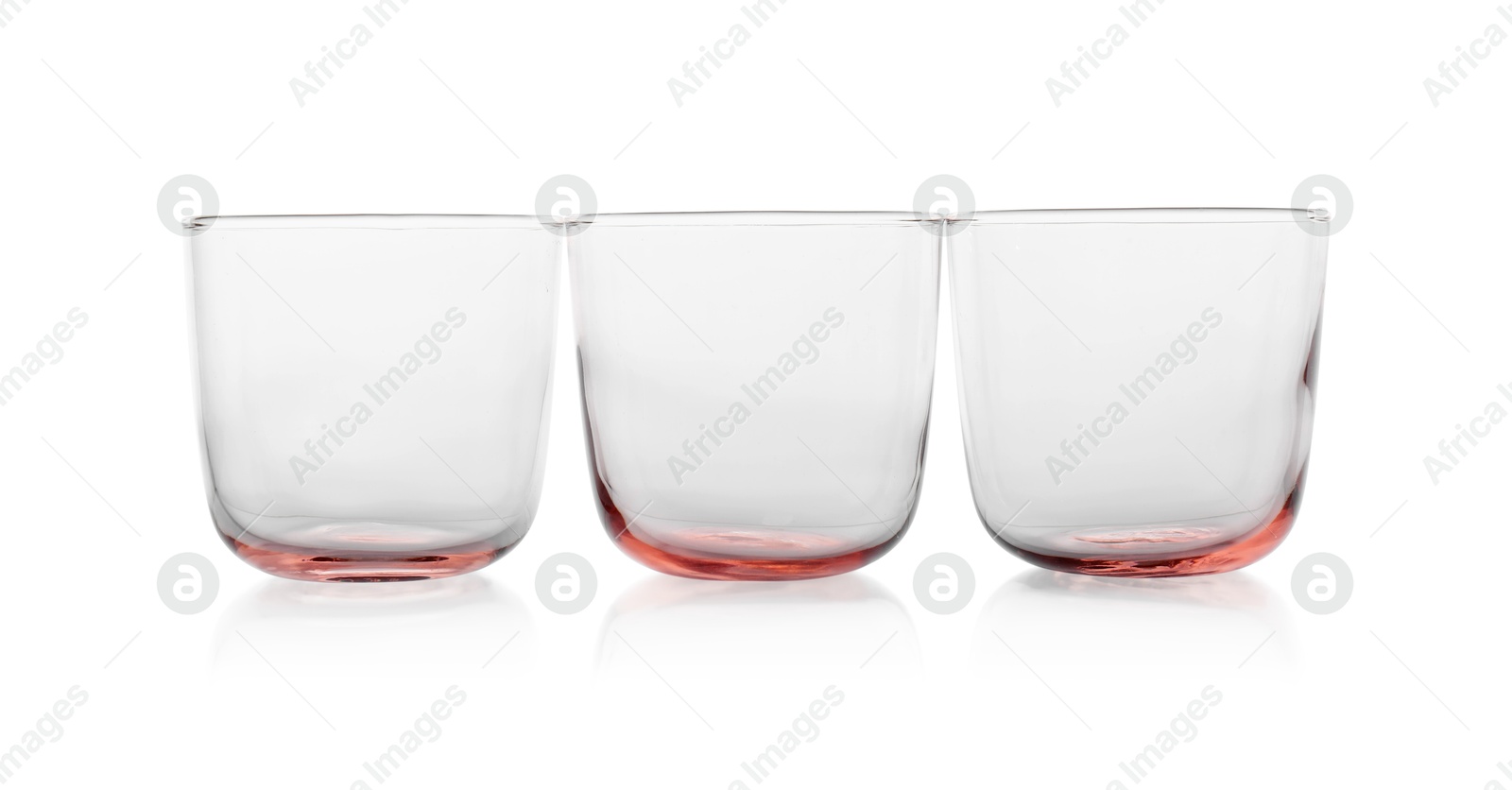 Photo of Three empty clean glasses isolated on white