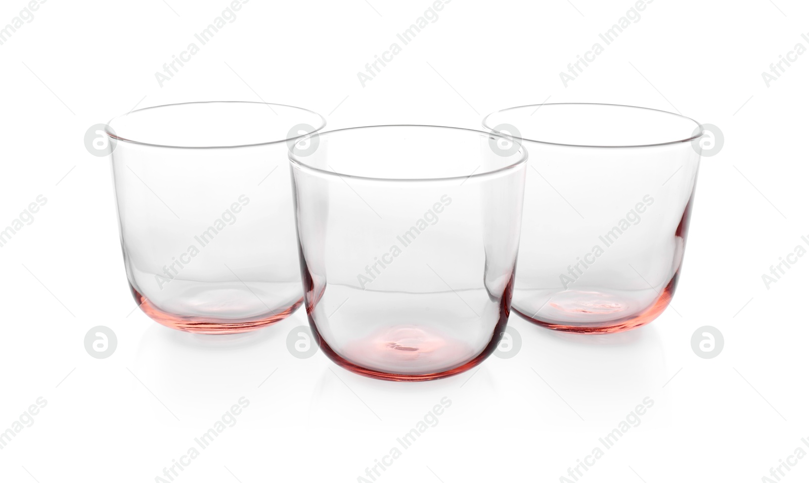 Photo of Three empty clean glasses isolated on white