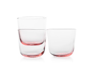 Photo of Three empty clean glasses isolated on white