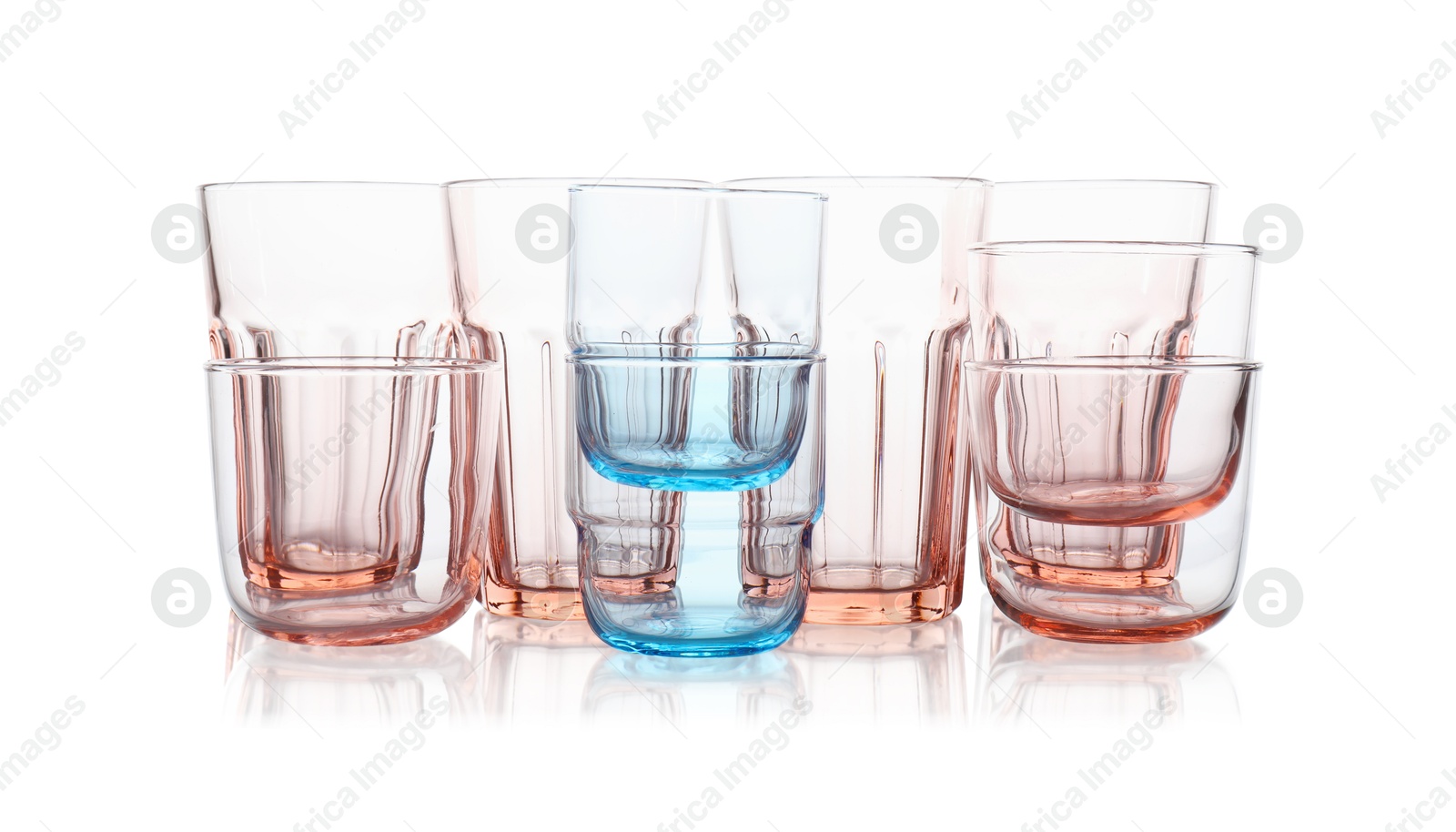 Photo of Many empty clean glasses isolated on white