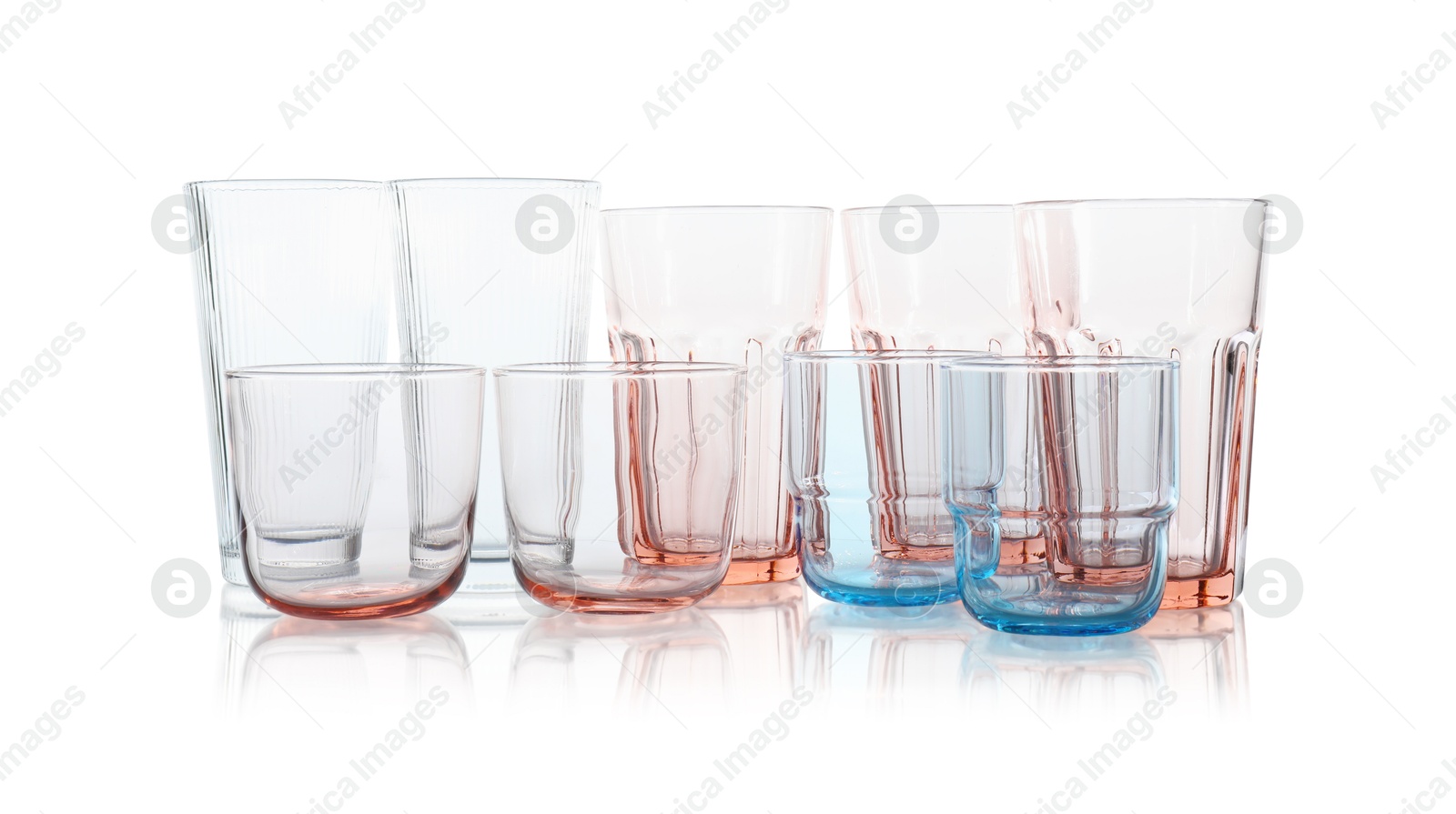 Photo of Many empty clean glasses isolated on white