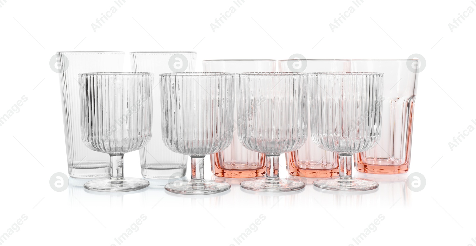 Photo of Many empty clean glasses isolated on white