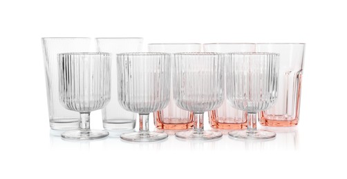 Photo of Many empty clean glasses isolated on white