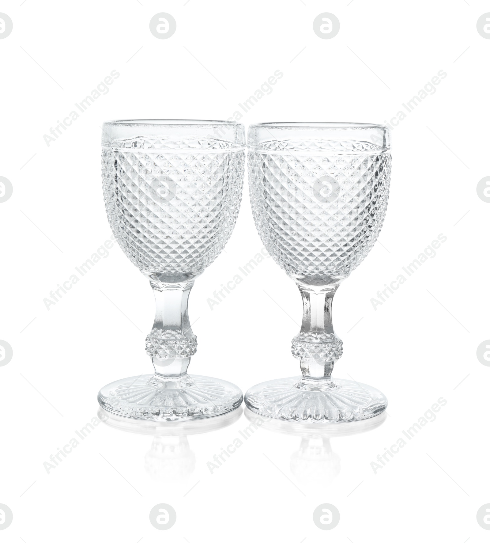 Photo of Two empty clean glasses isolated on white