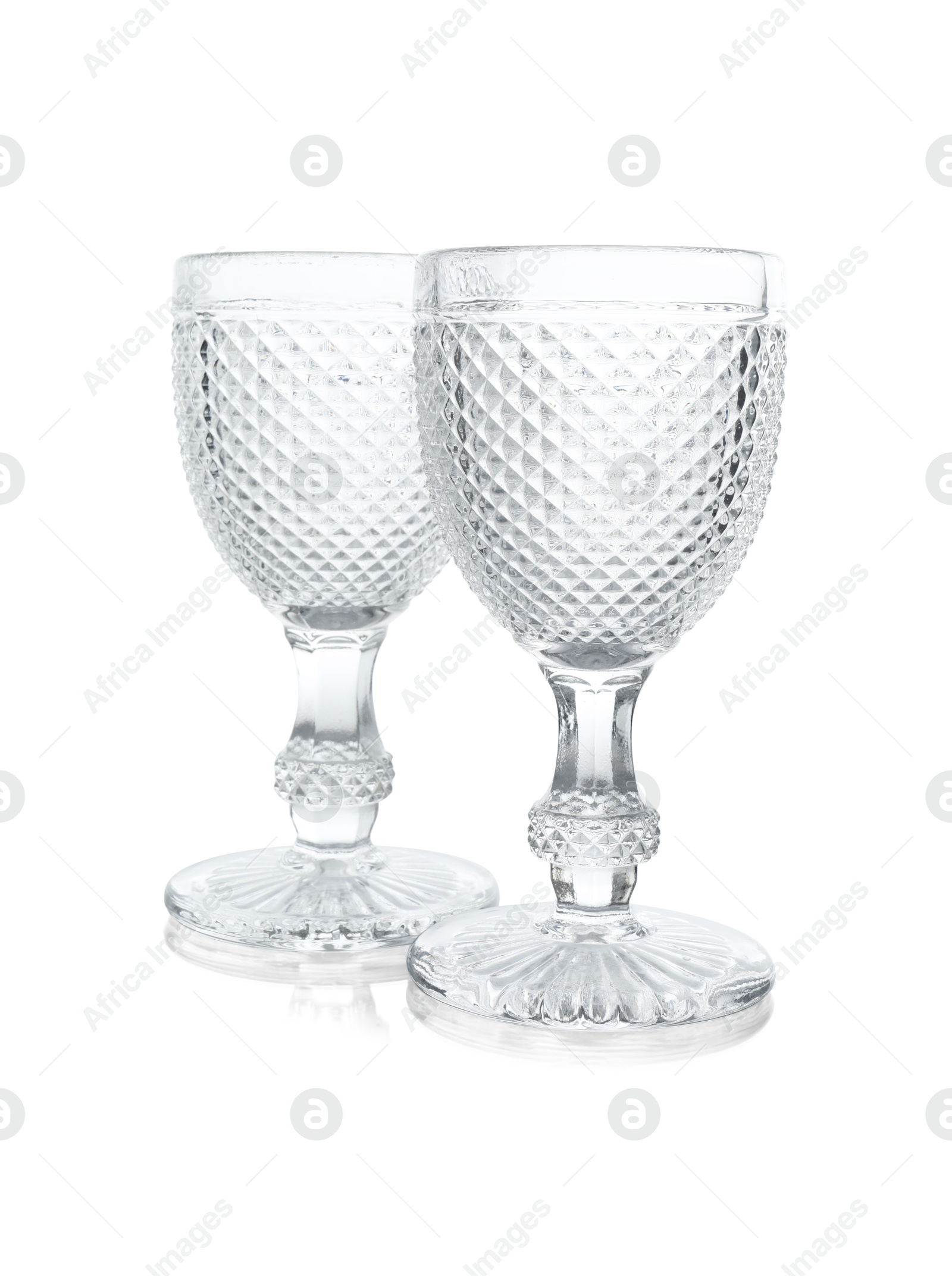 Photo of Two empty clean glasses isolated on white