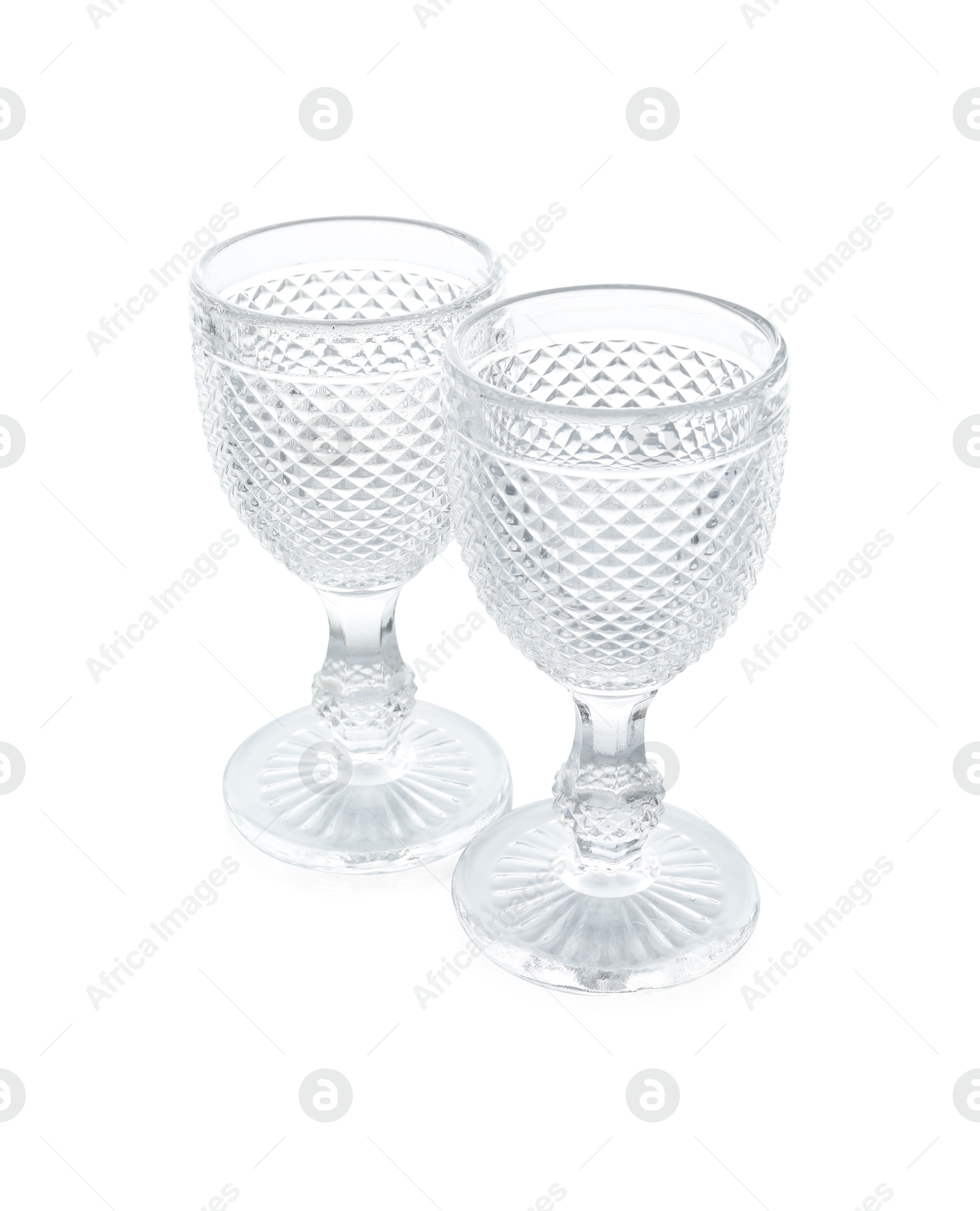 Photo of Two empty clean glasses isolated on white