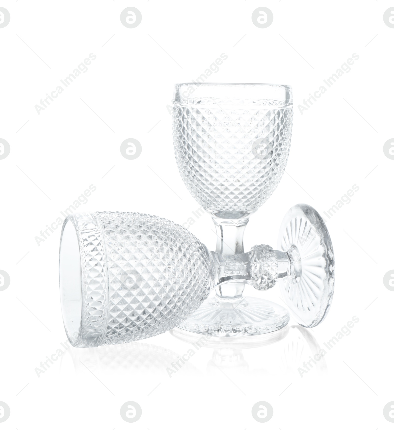 Photo of Two empty clean glasses isolated on white