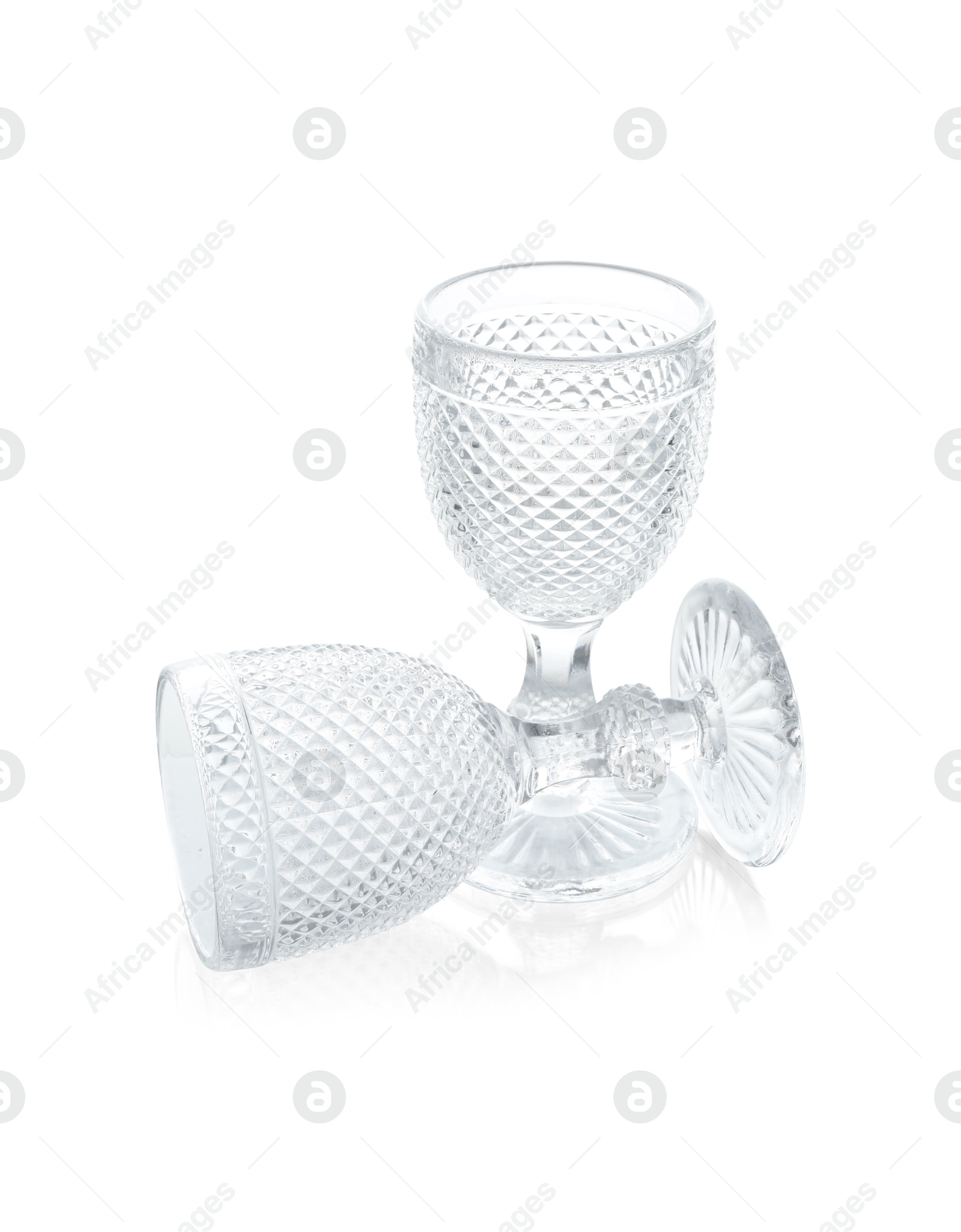 Photo of Two empty clean glasses isolated on white