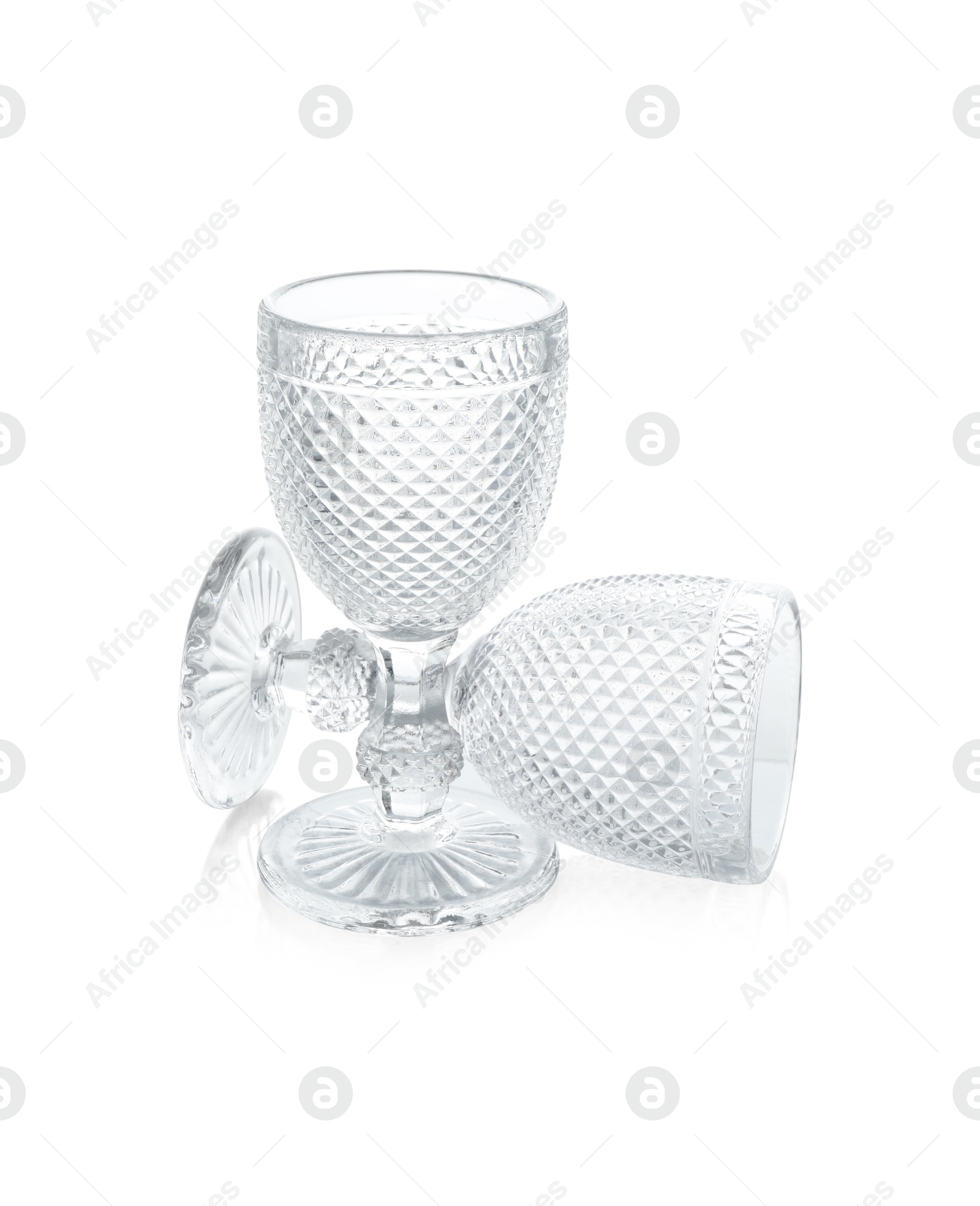 Photo of Two empty clean glasses isolated on white