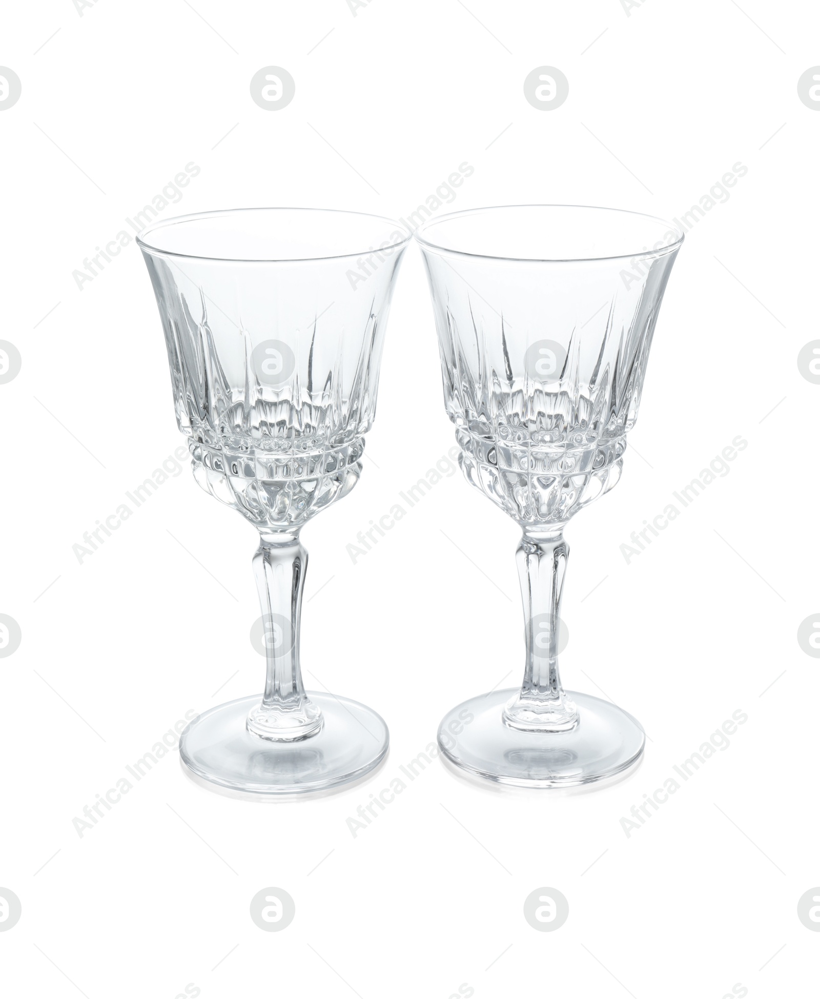 Photo of Two empty clean glasses isolated on white