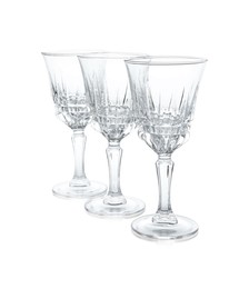 Photo of Three empty clean glasses isolated on white