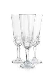 Photo of Three empty clean glasses isolated on white