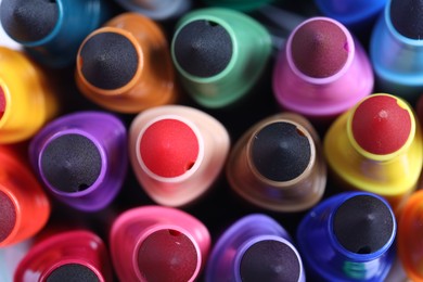 Photo of Many colorful markers as background, top view