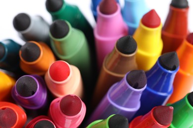 Photo of Many colorful markers on white background, closeup