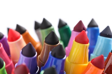 Photo of Many colorful markers on white background, closeup