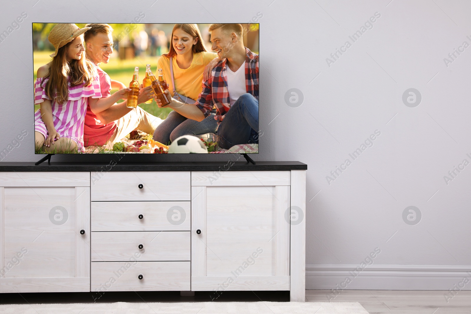 Image of Movie playing on TV set in room