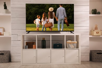 Image of Movie playing on TV set in room