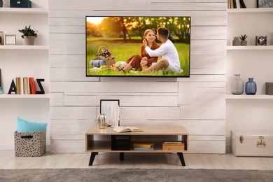 Image of Movie playing on TV set in room