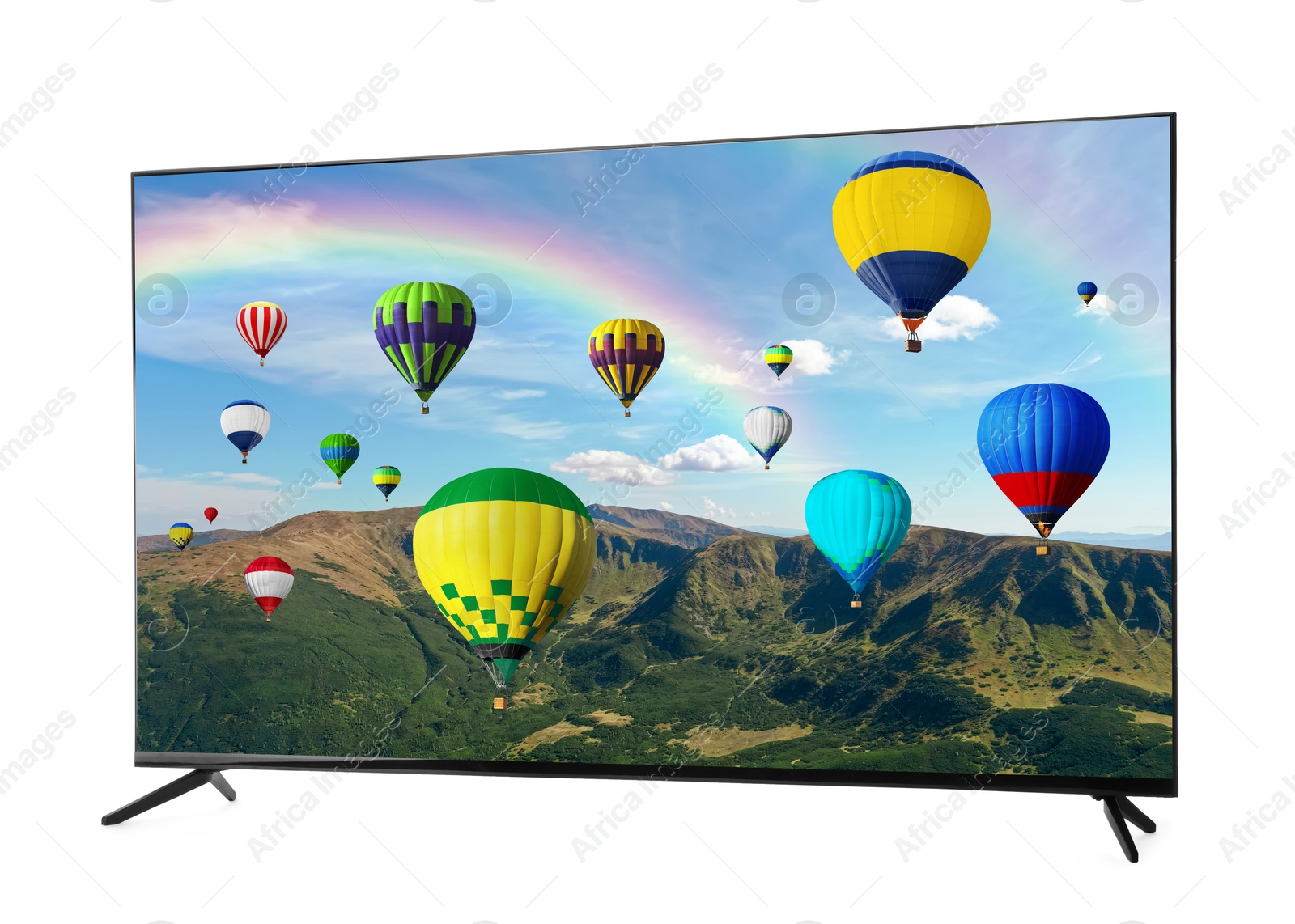 Image of TV set showing hot air balloons in mountains isolated on white