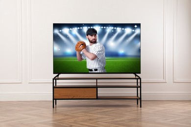 Image of Baseball game playing on TV set in room