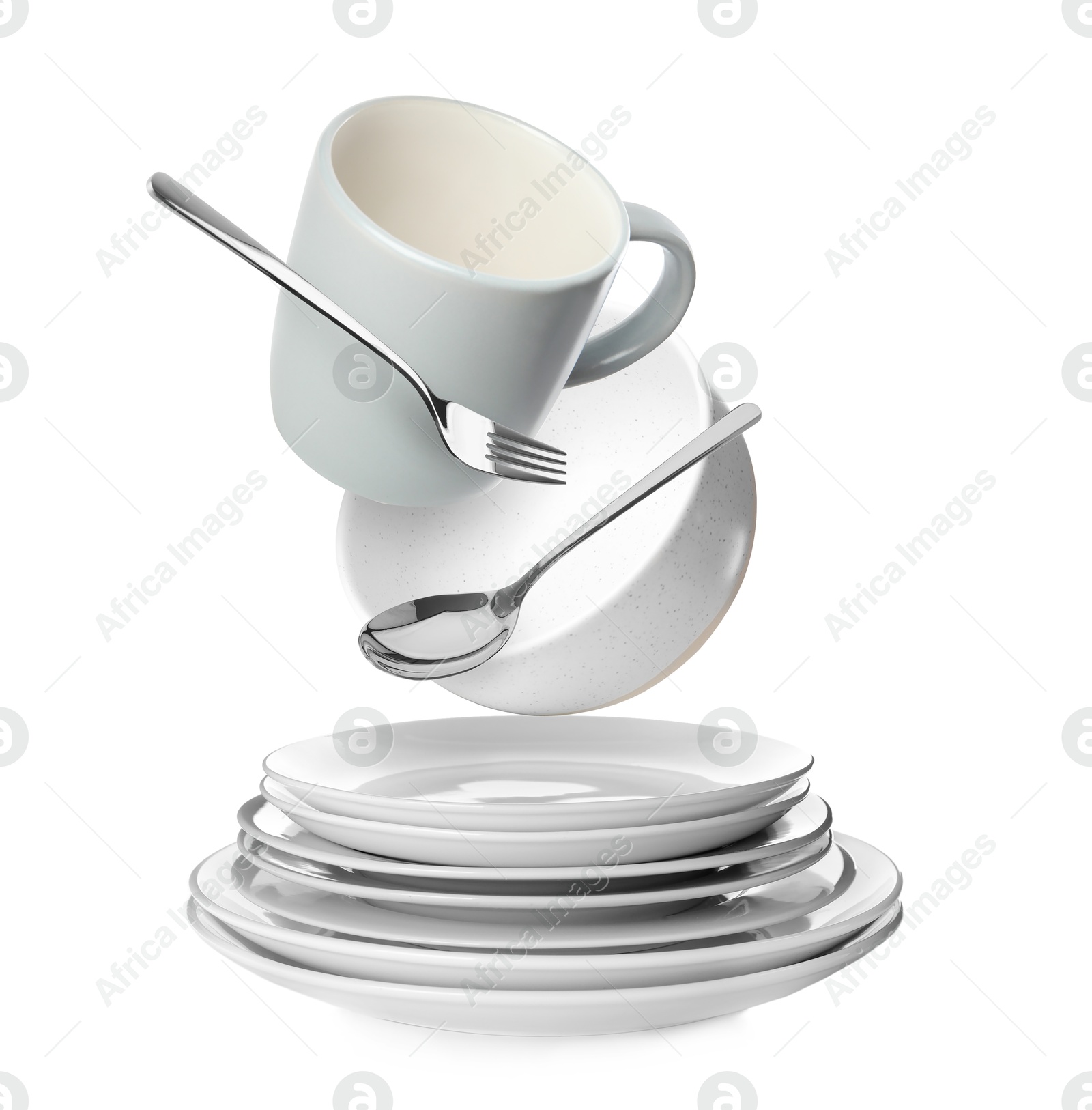 Image of Clean dishware and silverware flying over stacked plates on white background