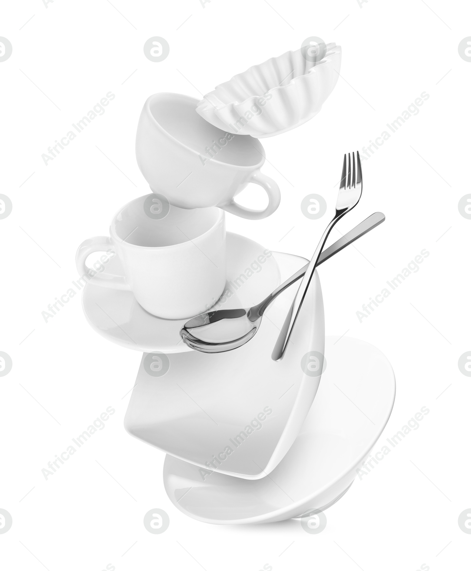 Image of Clean dishware and silverware flying on white background