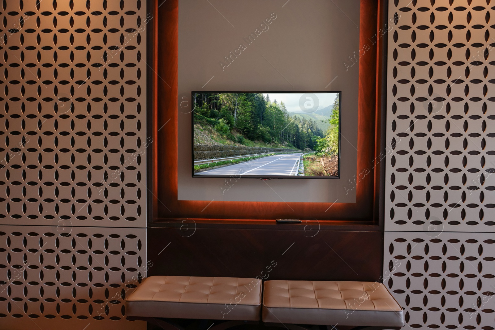 Image of TV set with mountain landscape on screen in room