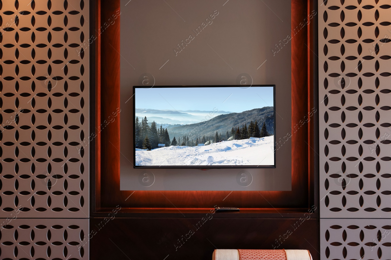 Image of TV set with mountain landscape on screen in room