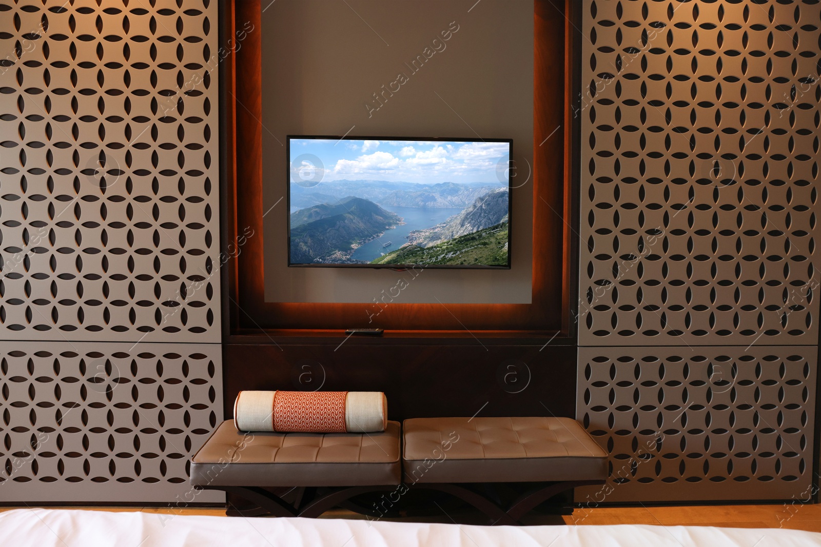 Image of TV set with mountain landscape on screen in room