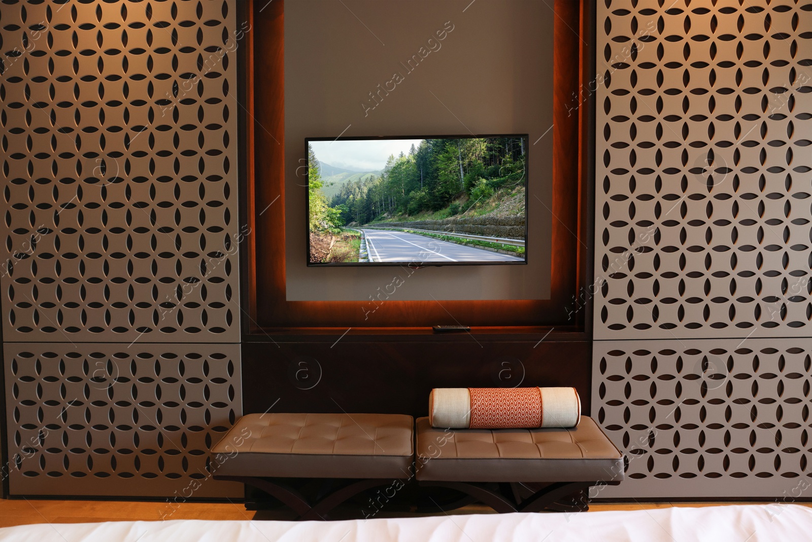 Image of TV set with mountain landscape on screen in room