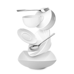 Image of Clean dishware and silverware flying over bowl on white background