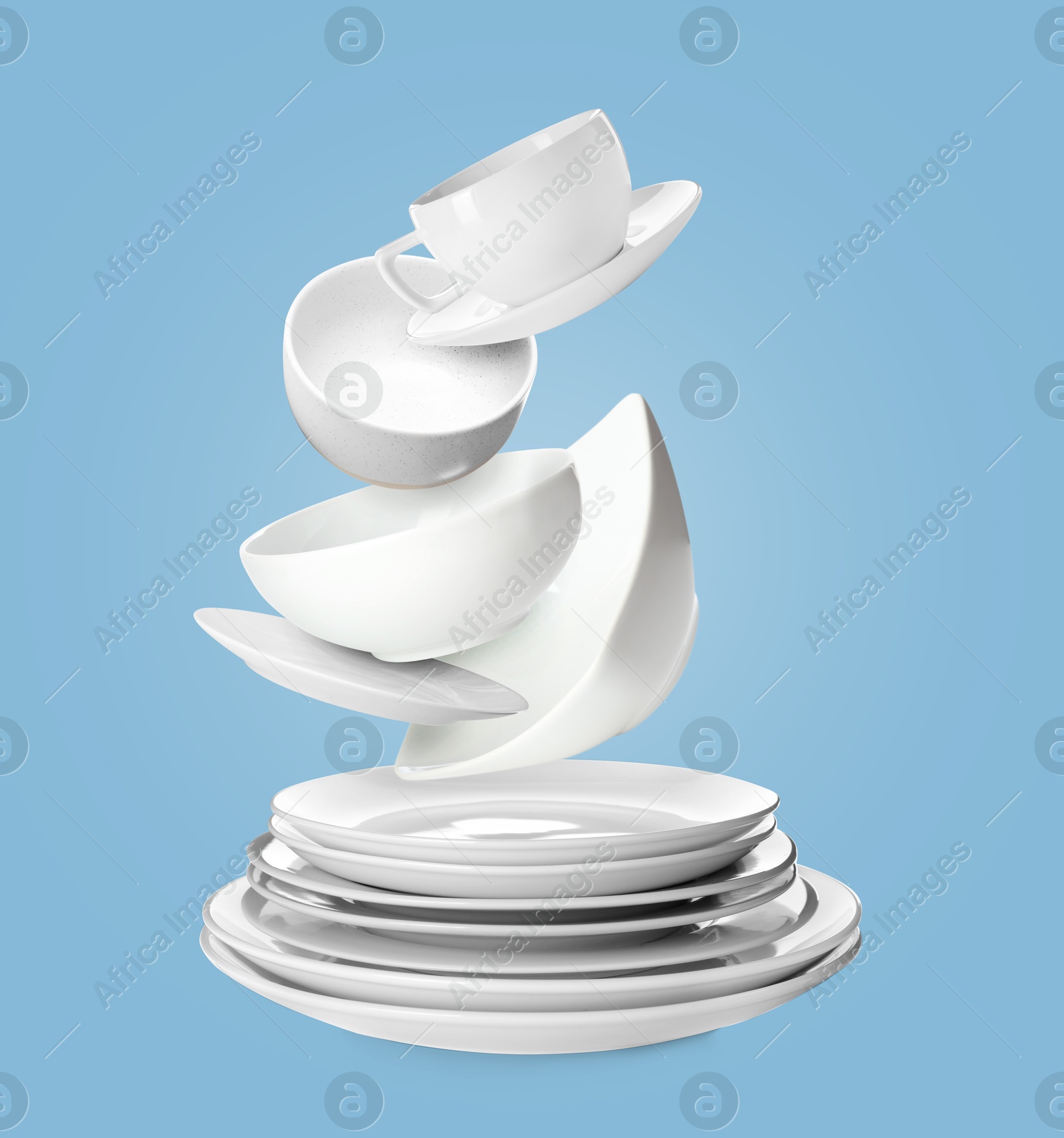 Image of Clean dishware flying over plates on pastel blue background