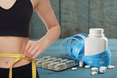 Image of Weight loss. Slim woman measuring her waist with tape and pills, closeup