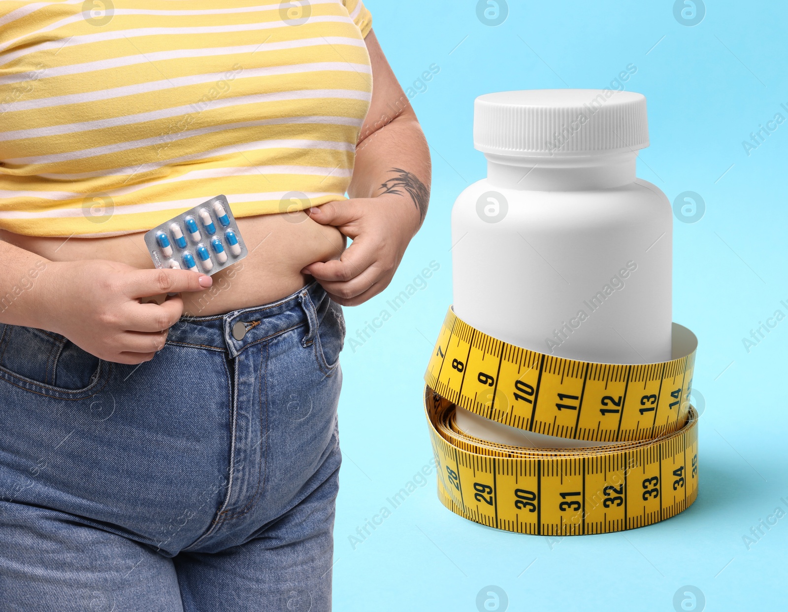 Image of Weight loss. Overweight woman and bottle of pills with measuring tape on light blue background, closeup